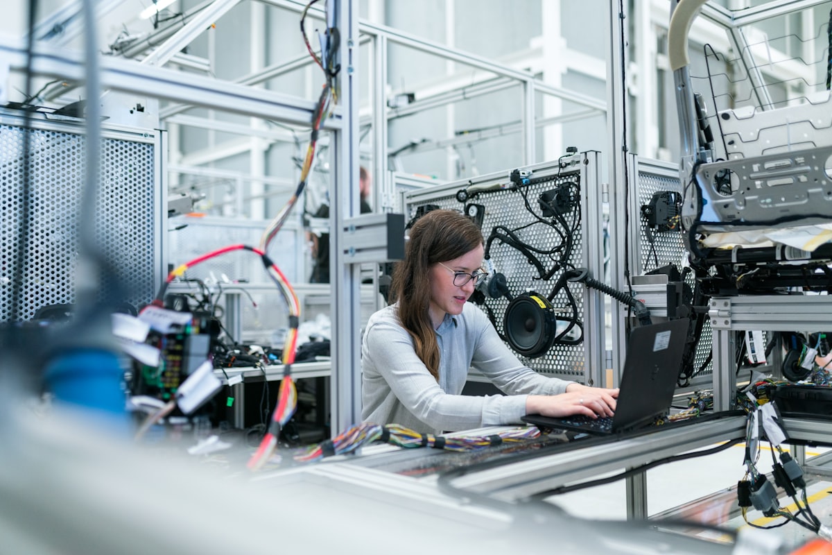 Automated production floor with precision robotics and environmental monitoring.