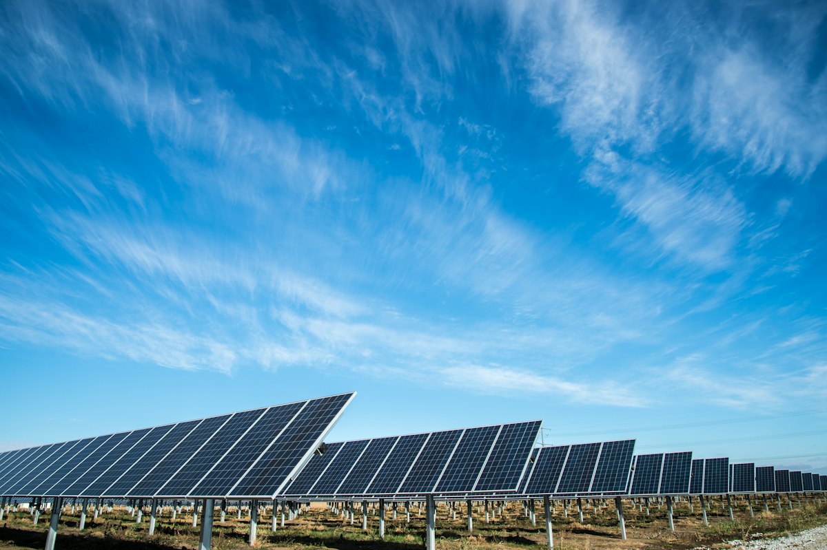 Commercial solar panel array generating clean energy and operational metrics.