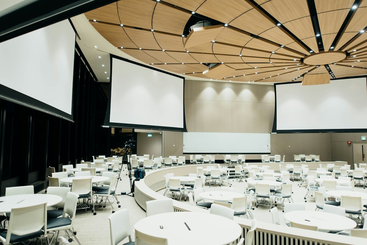 Large convention center auditorium hosting corporate conference events.
